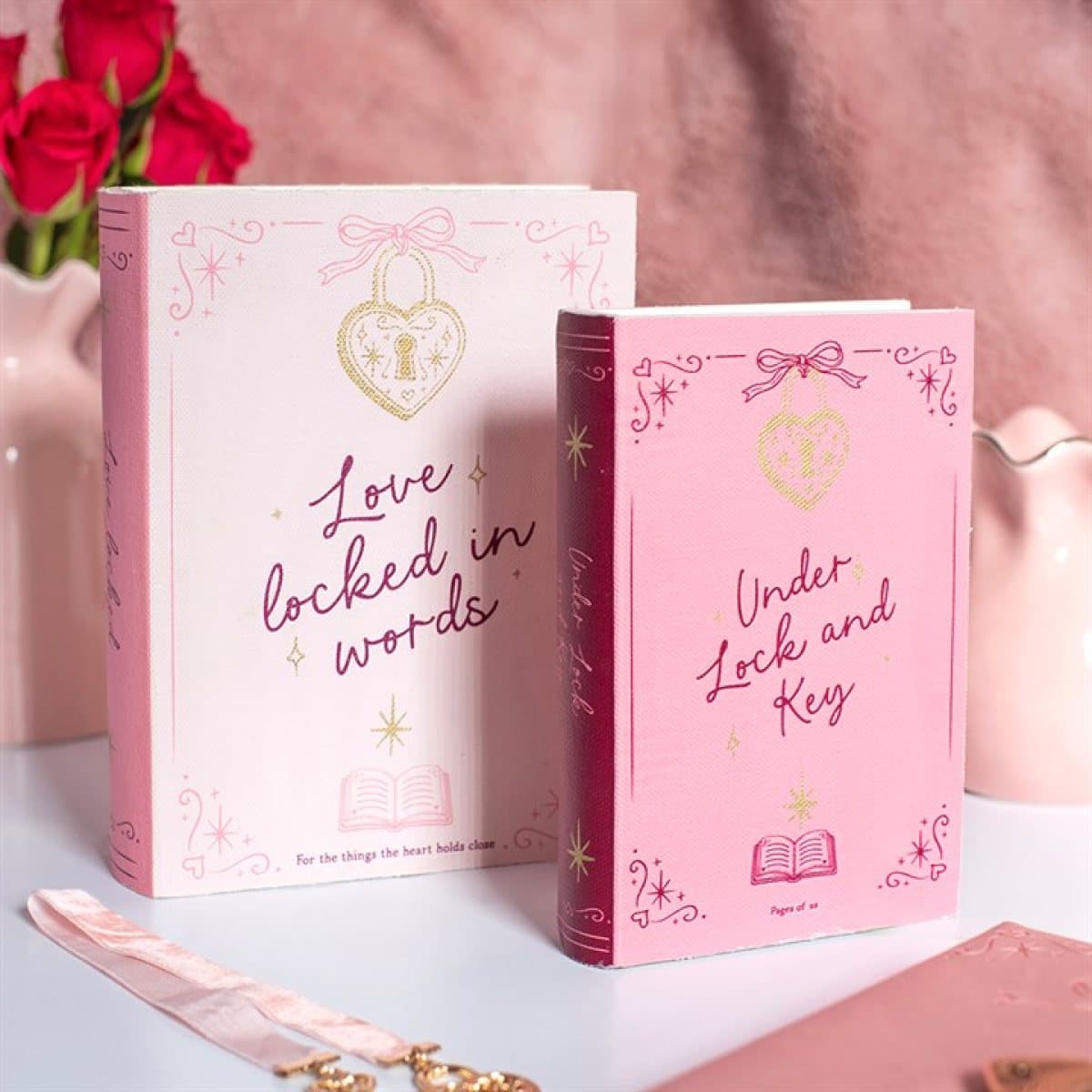 Set of two pink heart locket book-shaped storage boxes standing upright