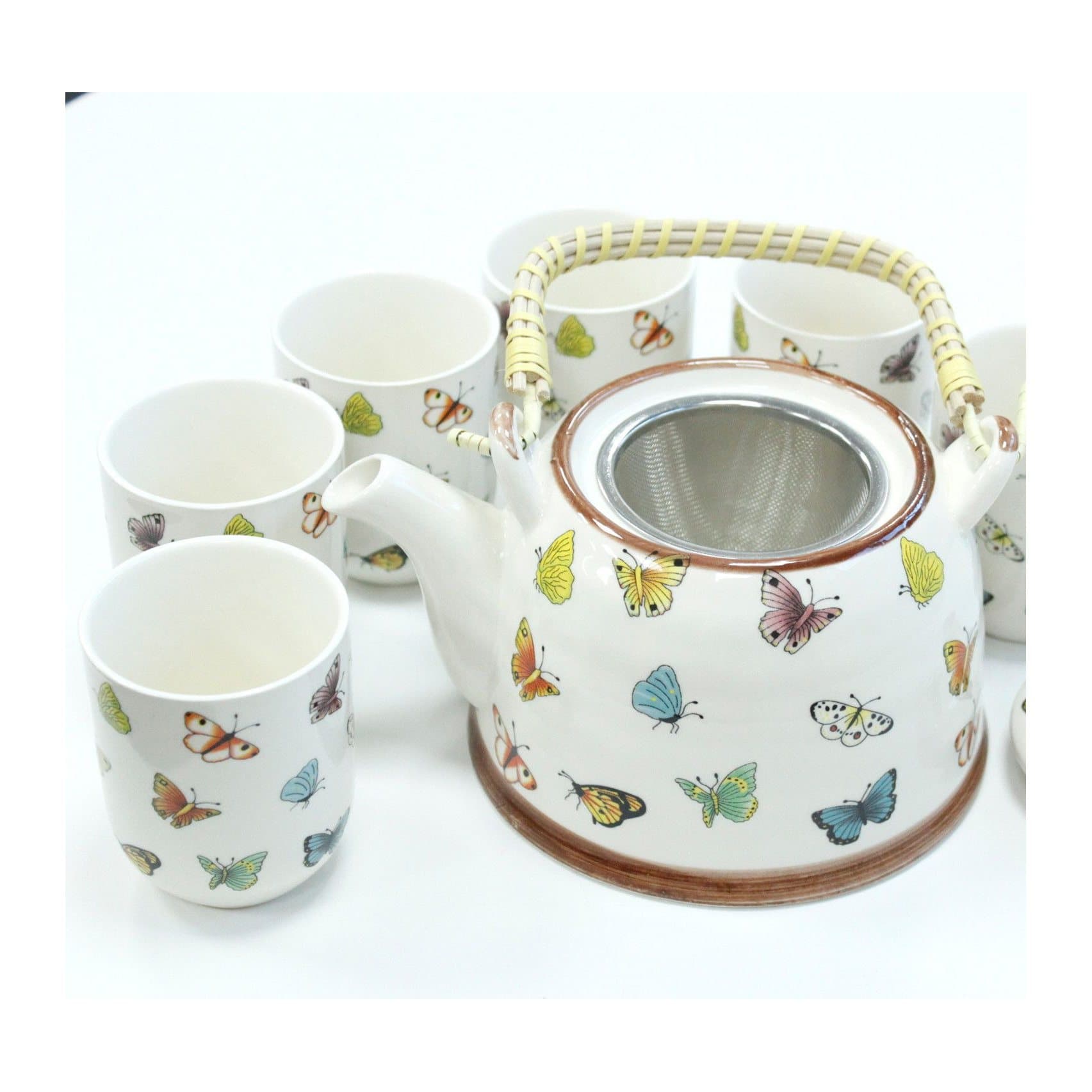 Ceramic teapot and six cups with a butterfly design