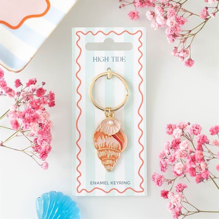 Enamel shell keyring with a gold-toned finish and soft coastal tones