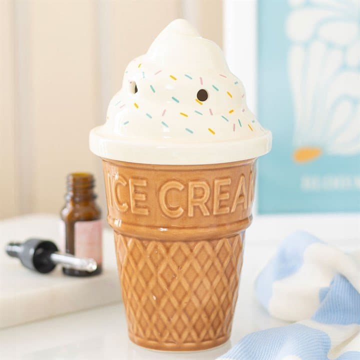 Ceramic oil burner shaped like an ice cream cone with a swirl-effect lid