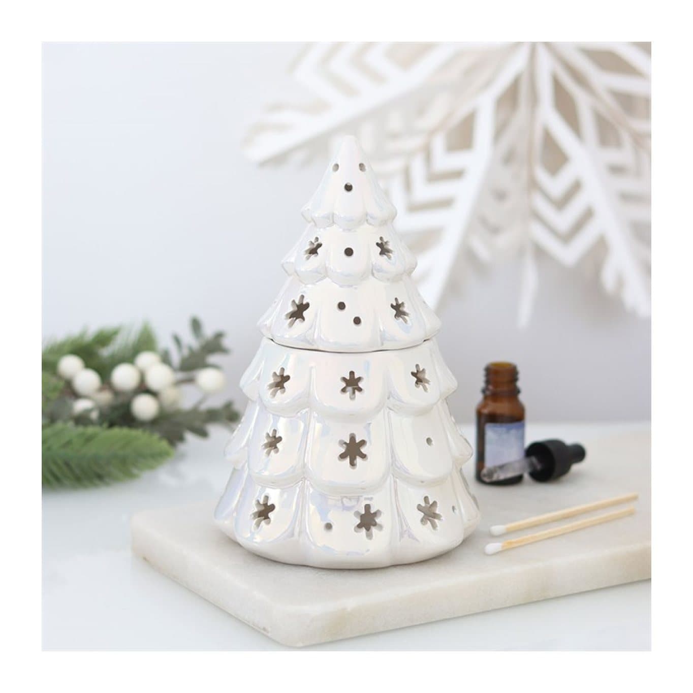Iridescent ceramic Christmas oil burner in a fir tree or snowflake shape