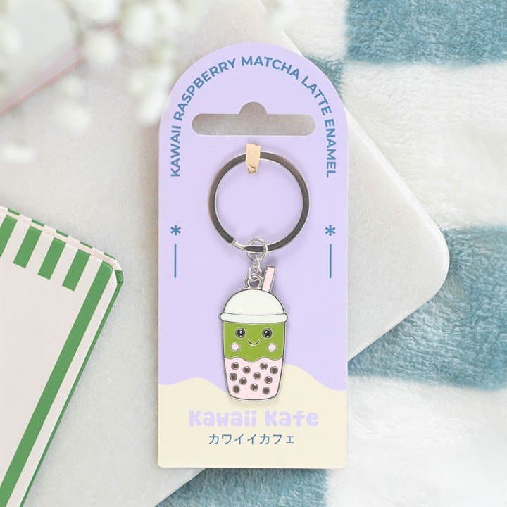 Enamel keyring of a kawaii matcha latte bubble tea character with colourful pearls