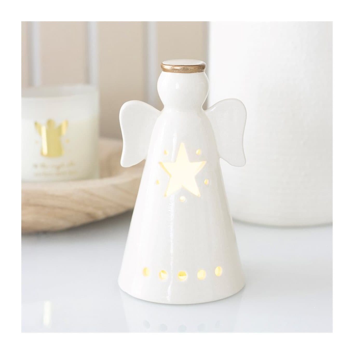 White ceramic LED angel with a star