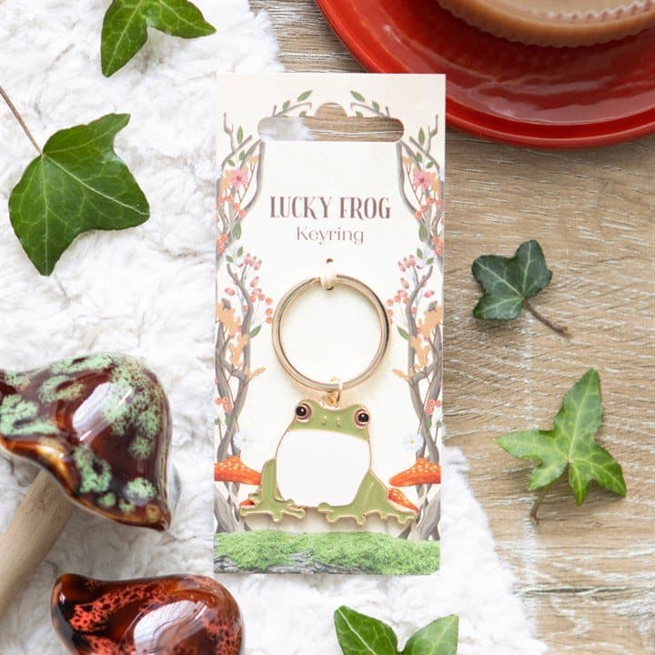 Lucky Frog keyring on a forest-themed header card