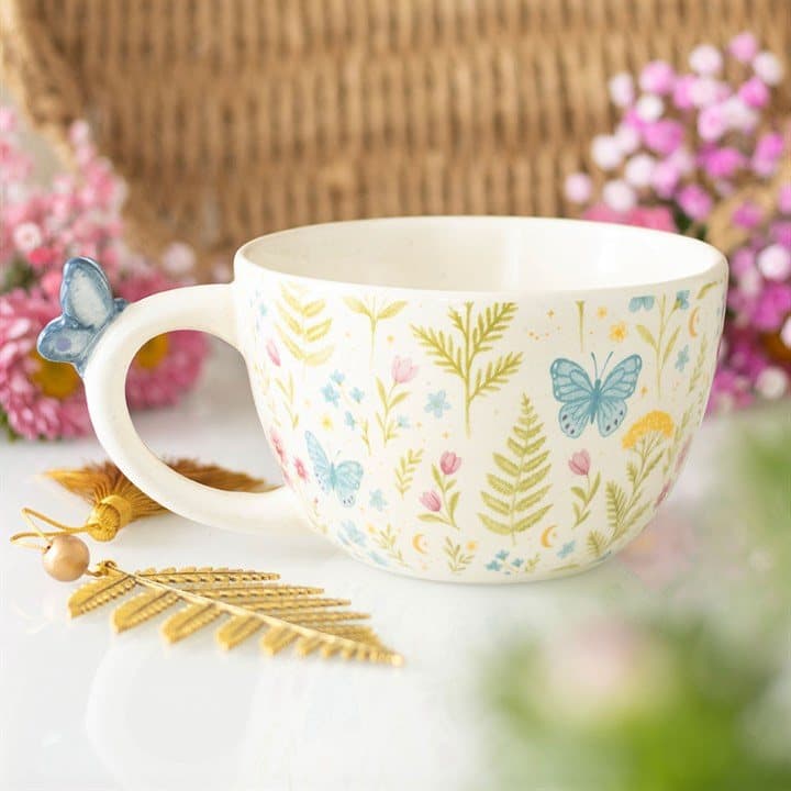 Floral mug with a blue butterfly on the handle