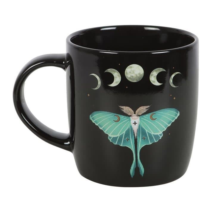 Black mug with a luna moth, moon phases, stars and flowers