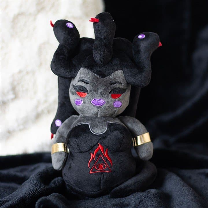 Medusa plush with twisted serpent hair, red embroidered eyes and metallic arm bands
