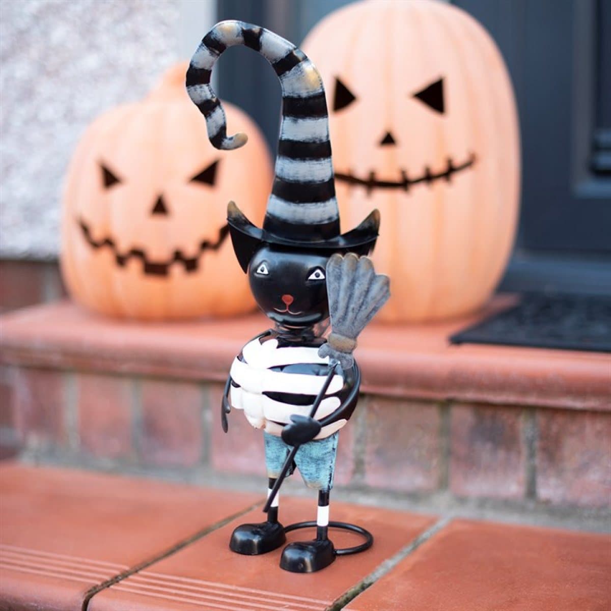Metal black cat in a witch hat ornament