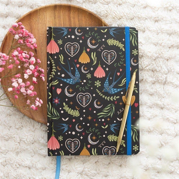 A5 notebook with a bold black floral cover
