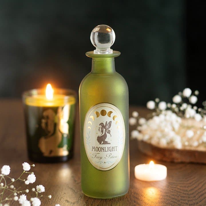 Green glass potion bottle with a crystal stopper and fairy label