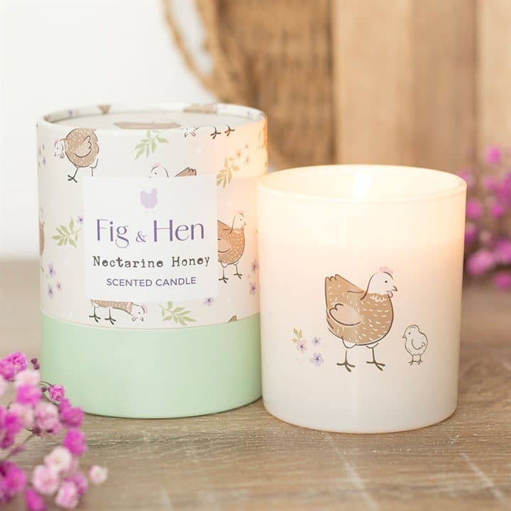 Cream glass candle with a hen and chick design