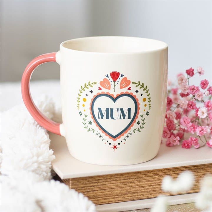 Ceramic mug with a folk heart design and Mum text