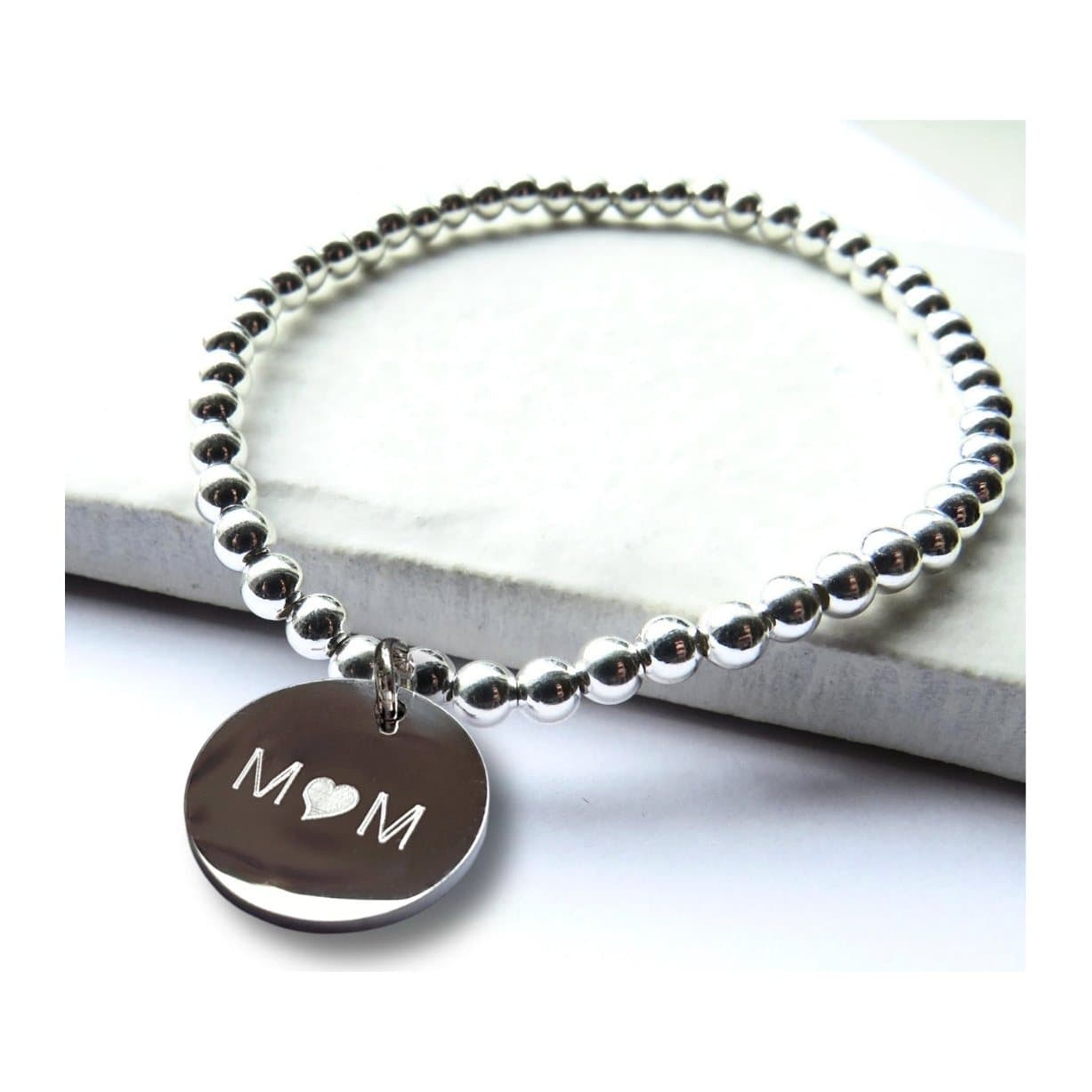 Silver beaded stretch bracelet with a Mum heart disc in stainless steel