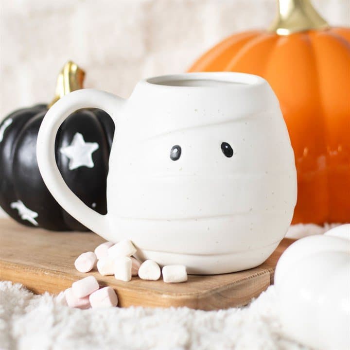 Rounded ceramic mug shaped like a mummy