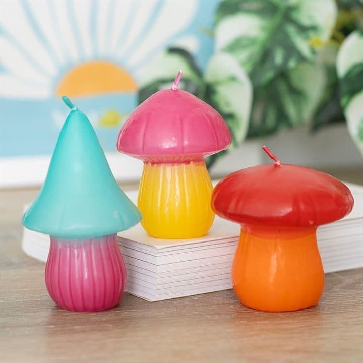 Three colourful mushroom candles