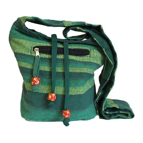 Forest green cotton Nepal sling bag with outside pockets and wide strap