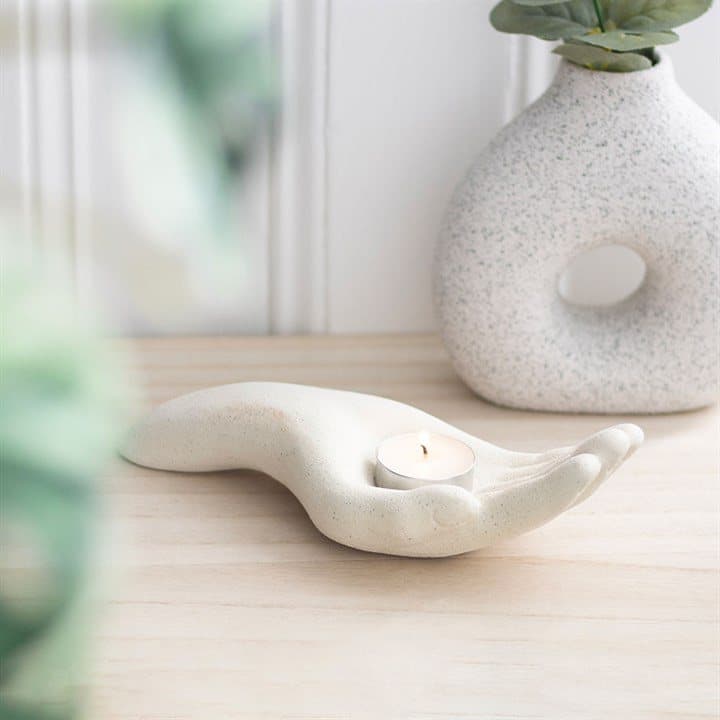 Open hand ceramic tealight holder