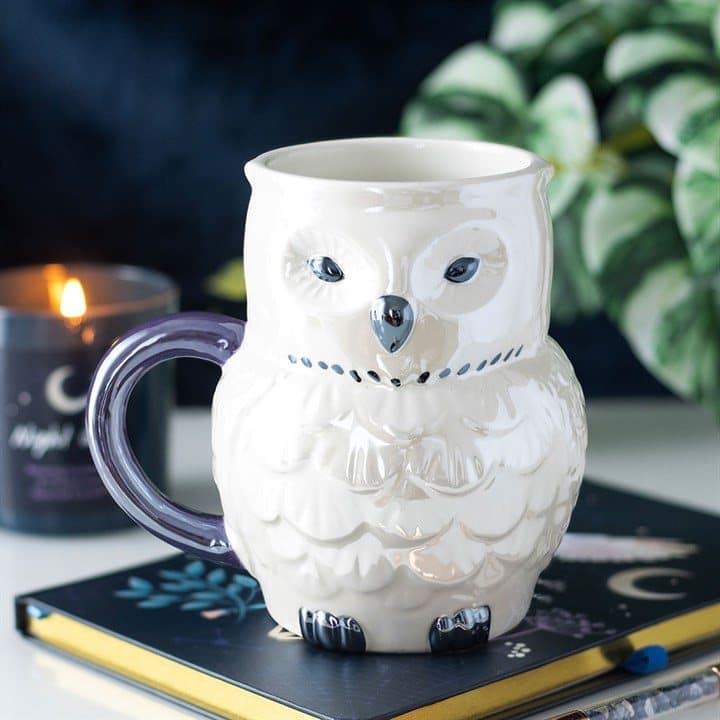 Ceramic mug shaped like an owl with an iridescent glaze