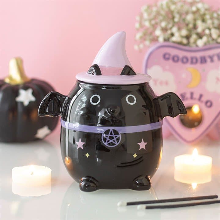 Pastel ceramic witch cat oil burner with bat wings and a witch hat