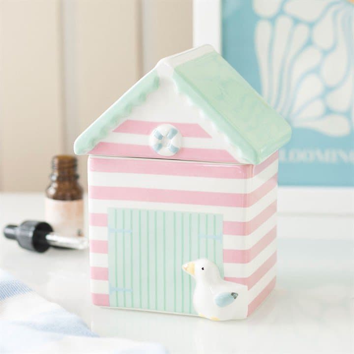 Pastel beach hut shaped ceramic oil burner with a removable lid