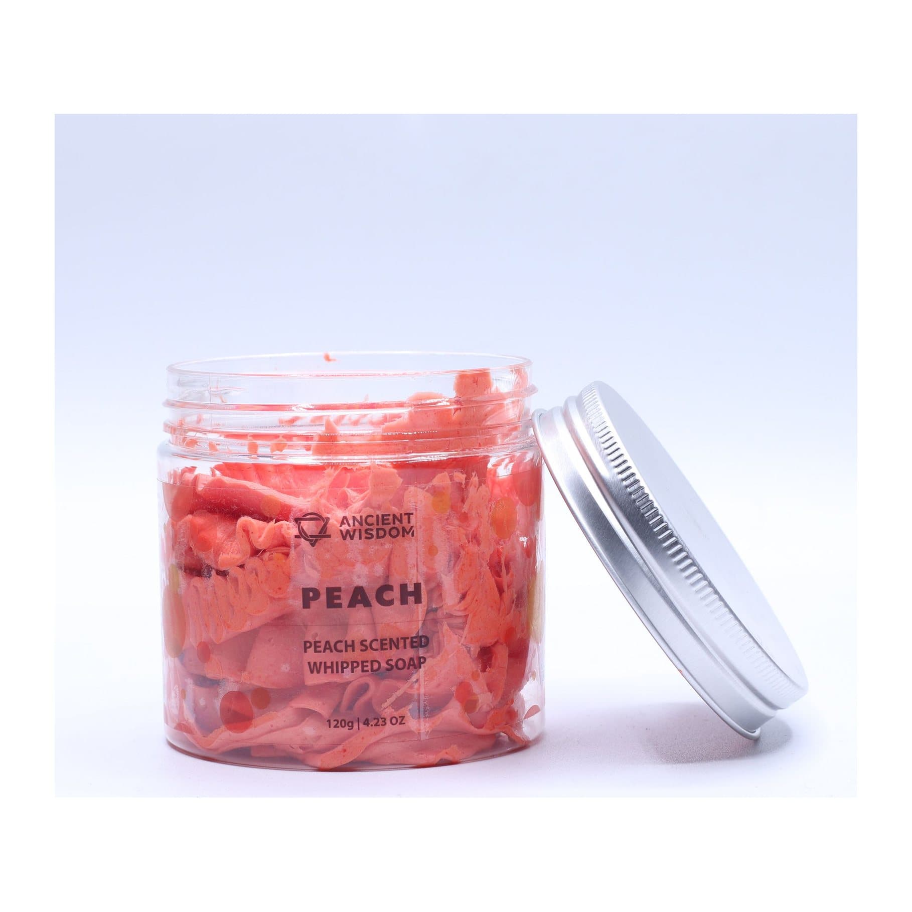 Peach whipped soap in a jar with a vibrant coral swirl