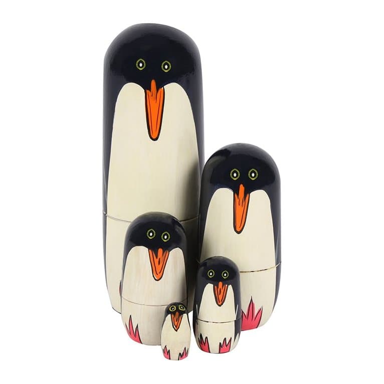 Handpainted wooden penguin Russian nesting dolls in a box with a window