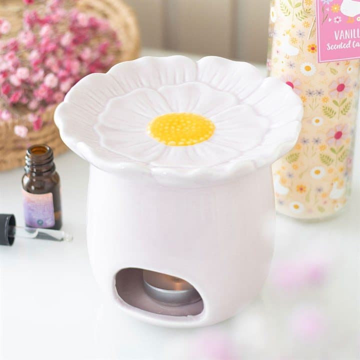 Pink ceramic oil burner shaped like a daisy