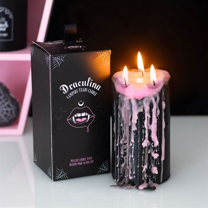 Pink pillar candle with bleeding wax