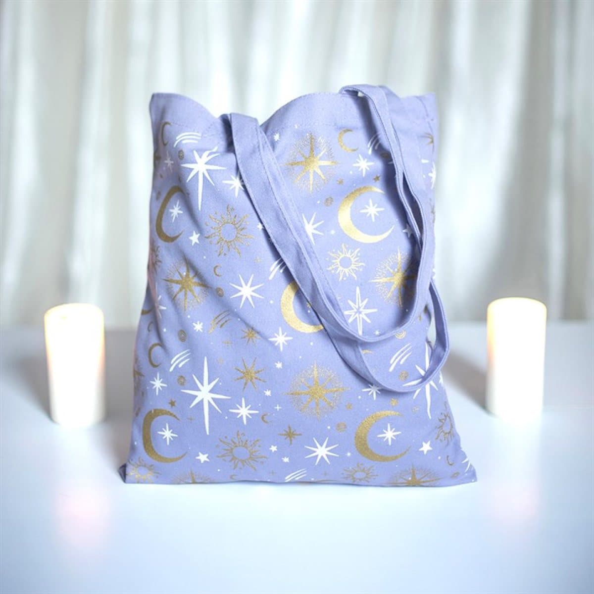 Pastel purple tote bag with moons and stars