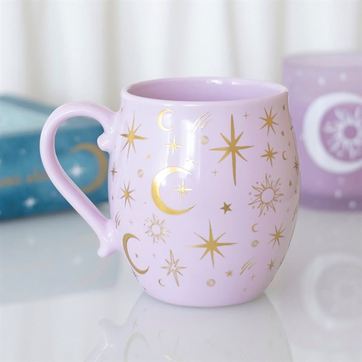 Purple mug with gold moons and suns