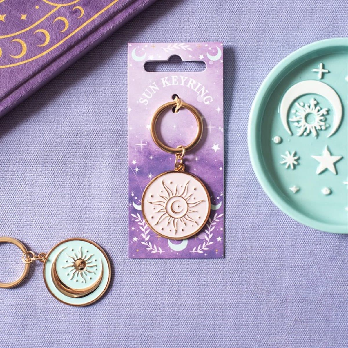 Purple sun keyring in soft pastel tones with gold-coloured accents