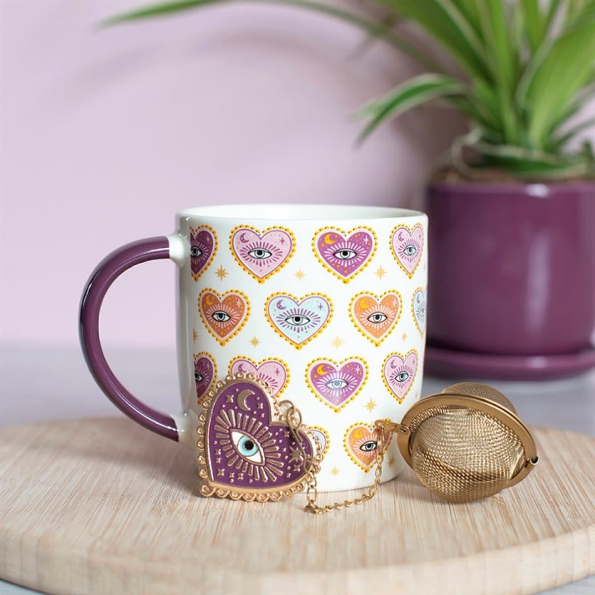 Sacred Sight mug with a tea infuser