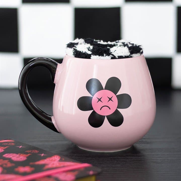Black and pink sad flower mug with checkerboard socks