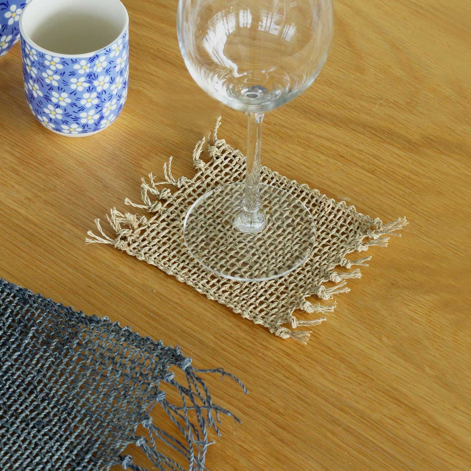 Set of four seagrass fringe coasters