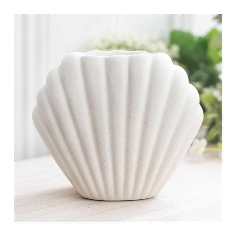 Neutral stone coloured ceramic seashell oil burner