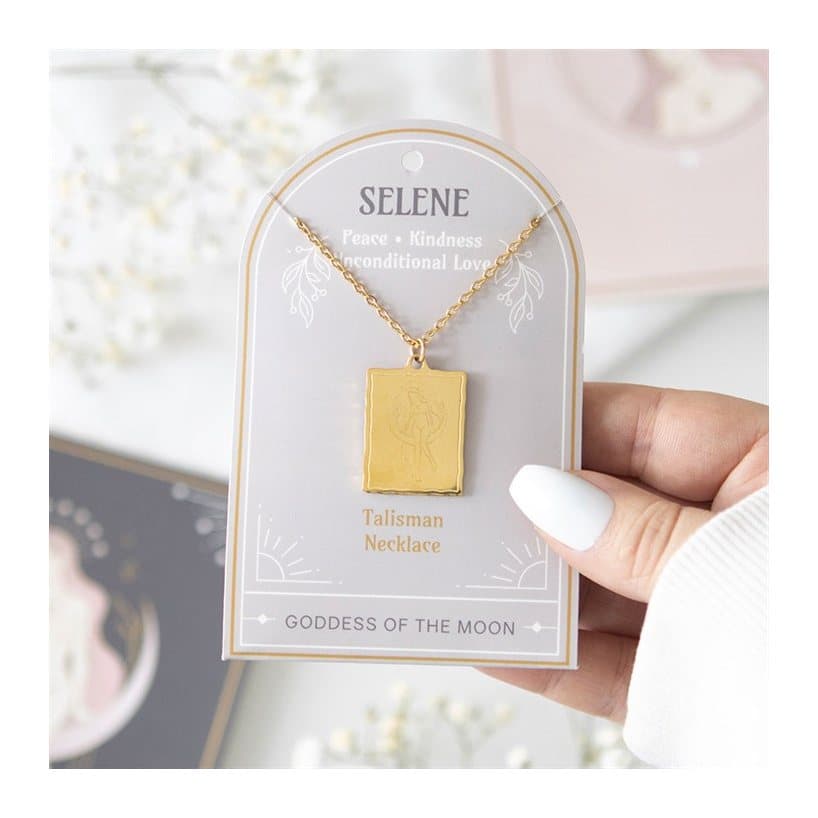 Gold-toned Selene goddess pendant necklace on a backing card