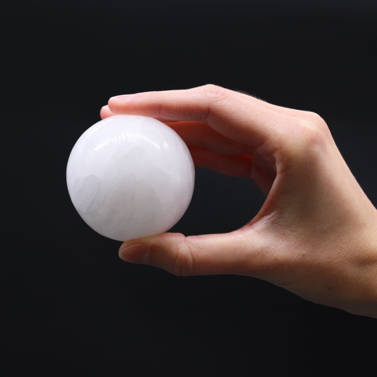 Milky selenite sphere, about 5.5 cm across