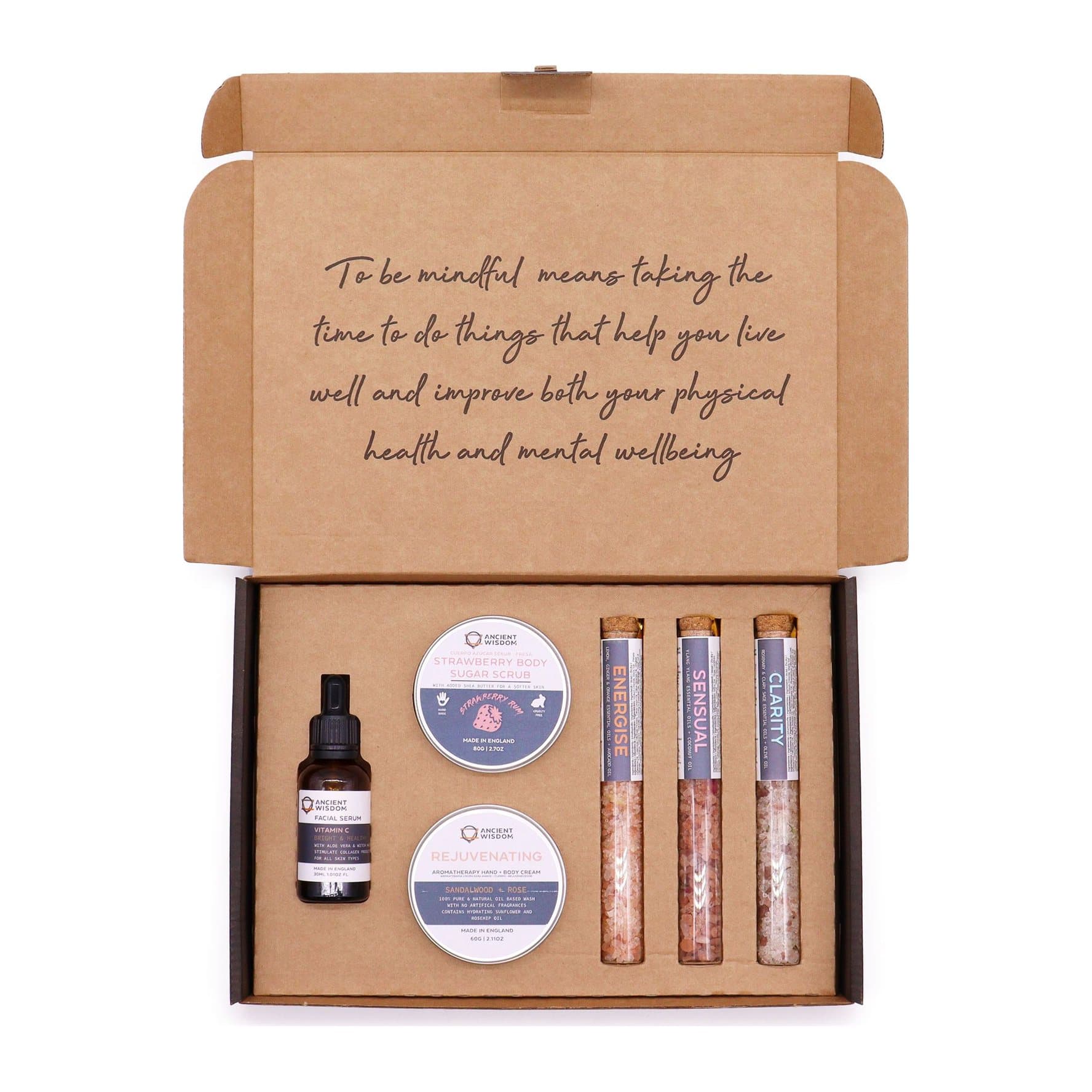 Boxed self care kit with body scrub, body cream, bath salt vials and serum