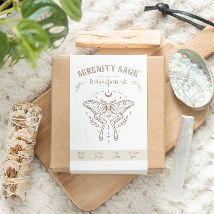 Smudge kit with white sage, selenite wand, palo santo and abalone shell in a box