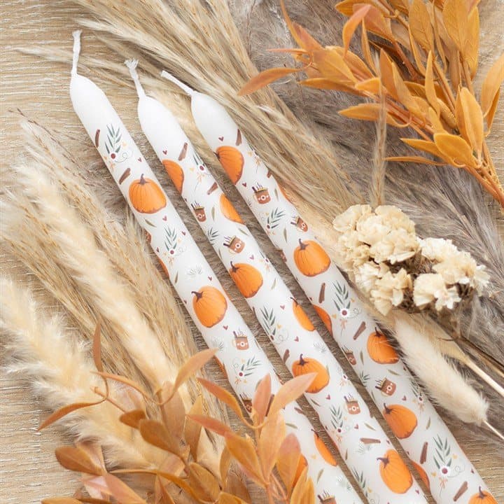 Set of three pumpkin print taper candles