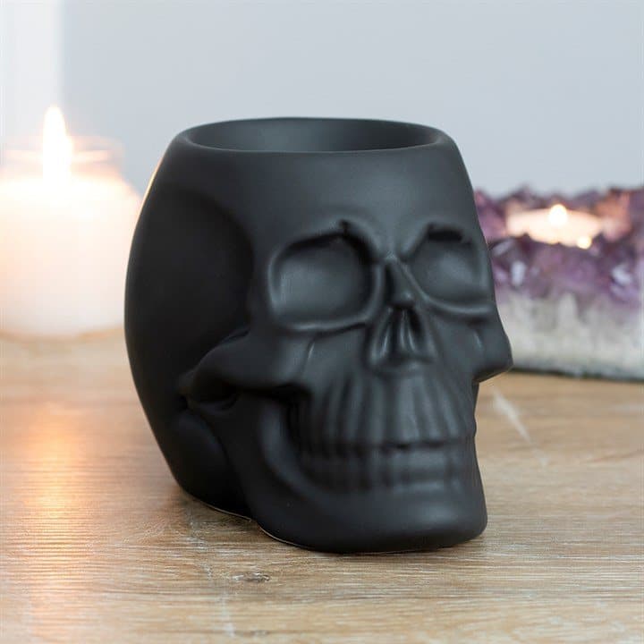Matt ceramic skull shaped oil burner in black and white