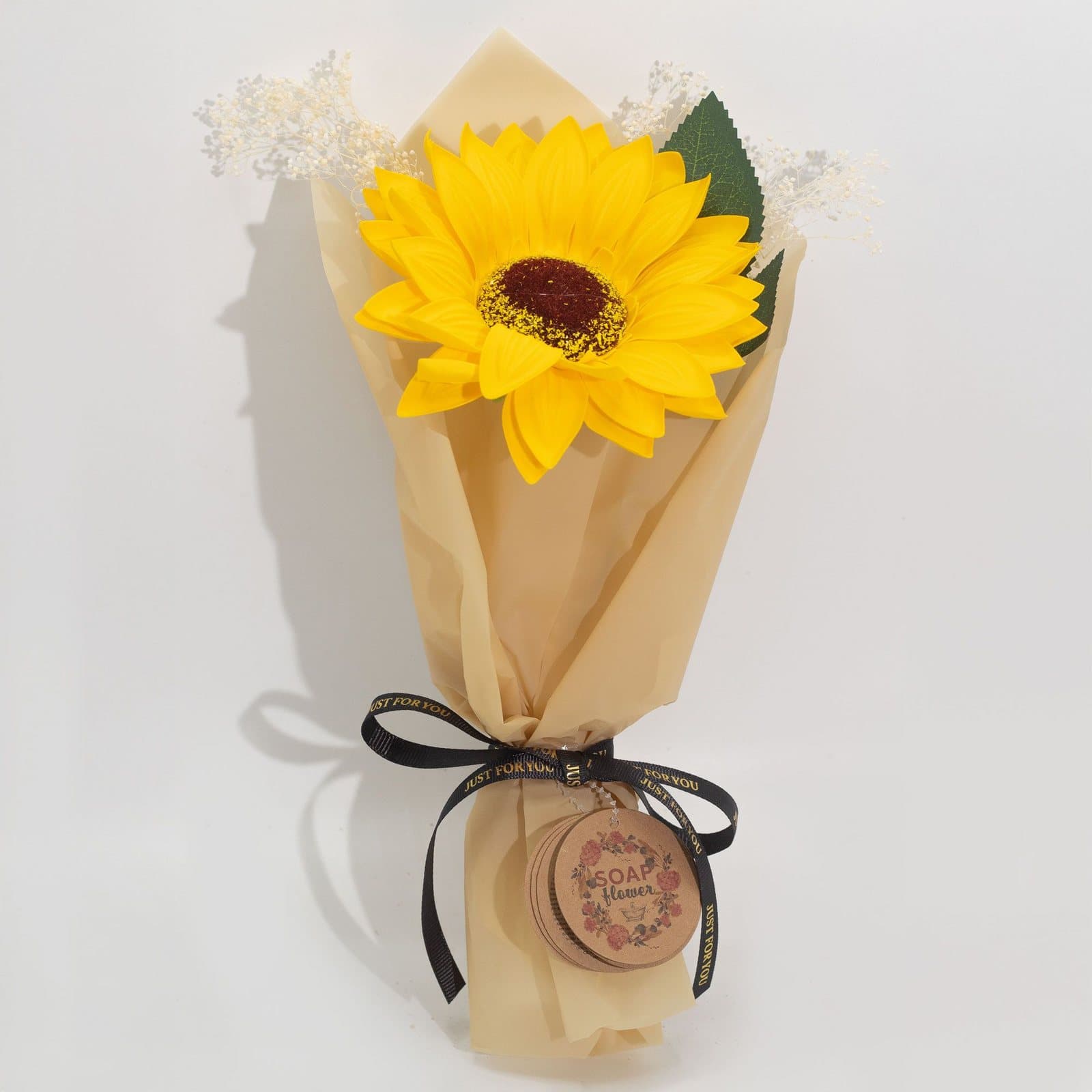 Single sunflower soap flower wrapped with ribbon and paper