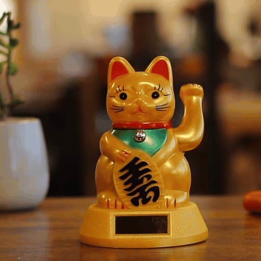Plastic lucky waving cat with a raised left hand
