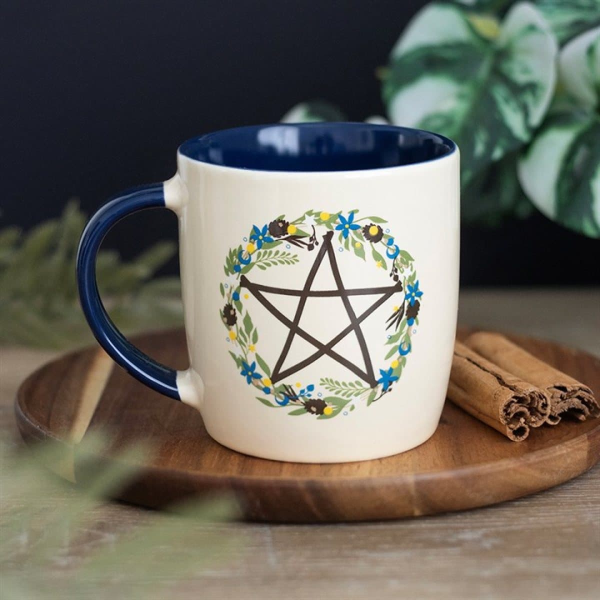 Ceramic mug with a botanical pentagram design