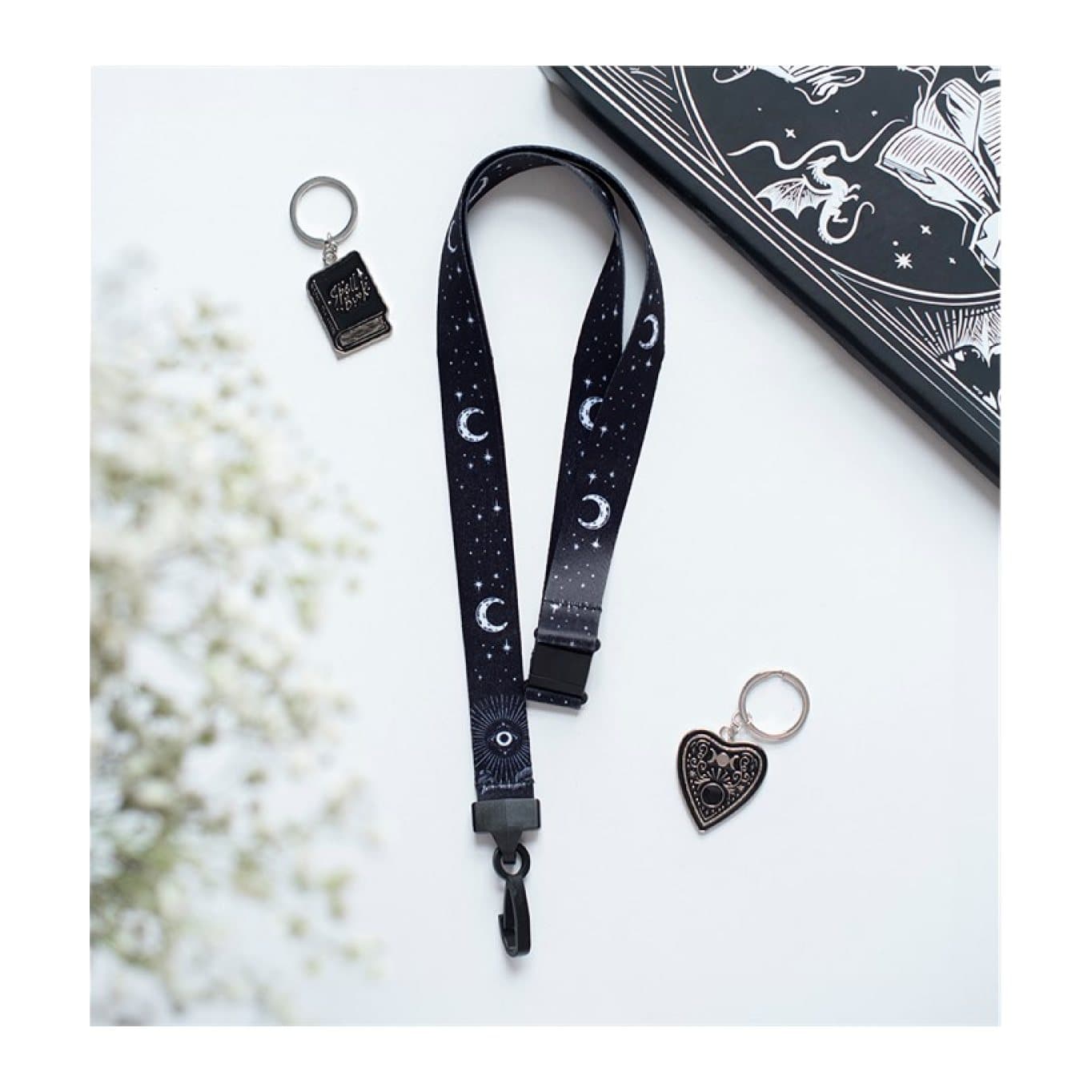 Black lanyard with moons, stars and an all-seeing eye design