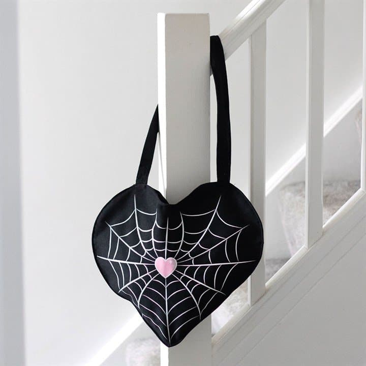 Satin tote bag with a spiderweb heart design