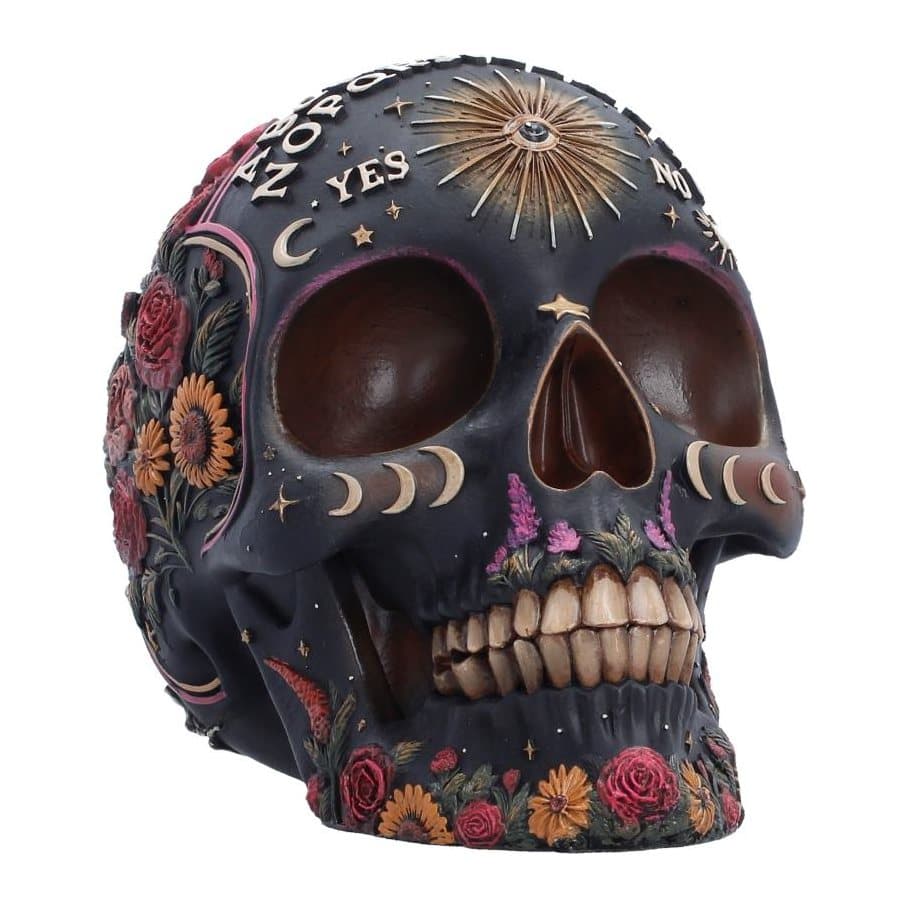 Resin skull with Ouija board lettering, floral detail and an all-seeing eye