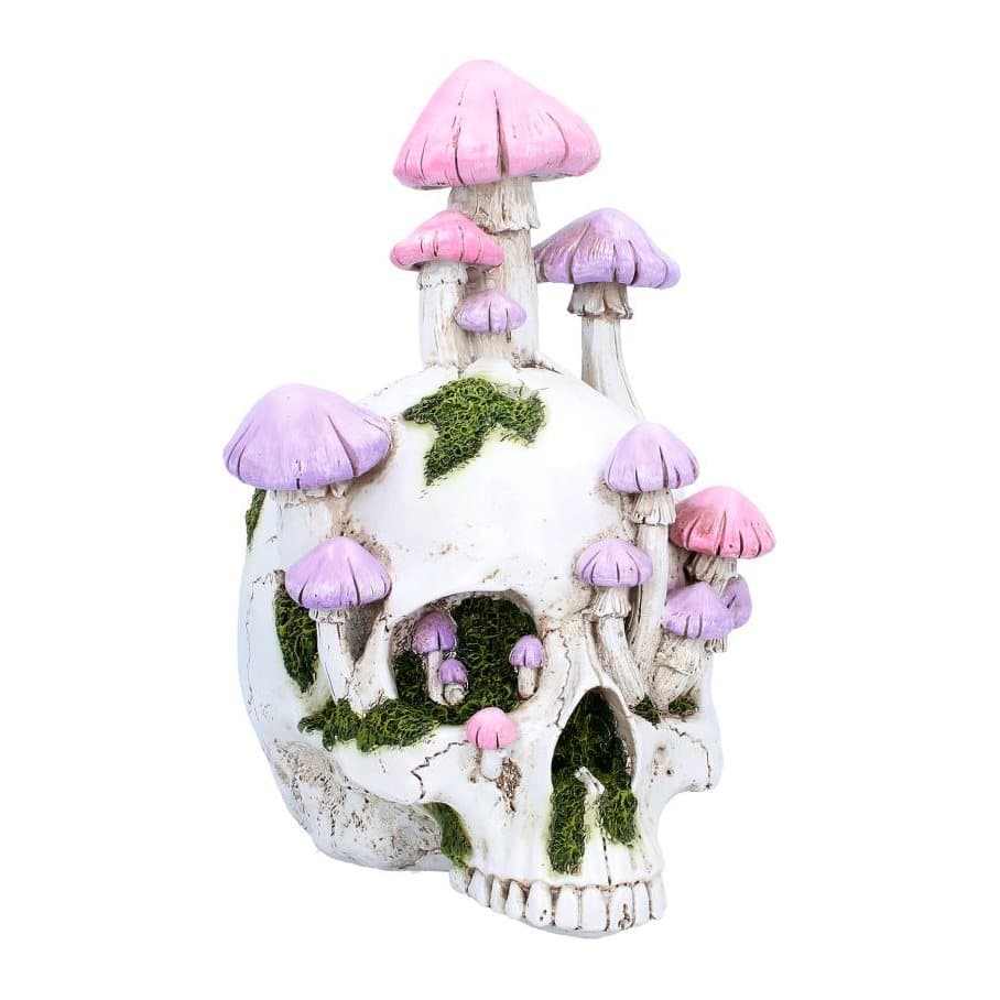 White resin skull figurine overgrown with pink and purple mushrooms and green moss