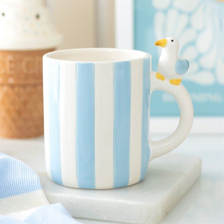 Ceramic mug with soft pastel stripes and a cheeky seagull design