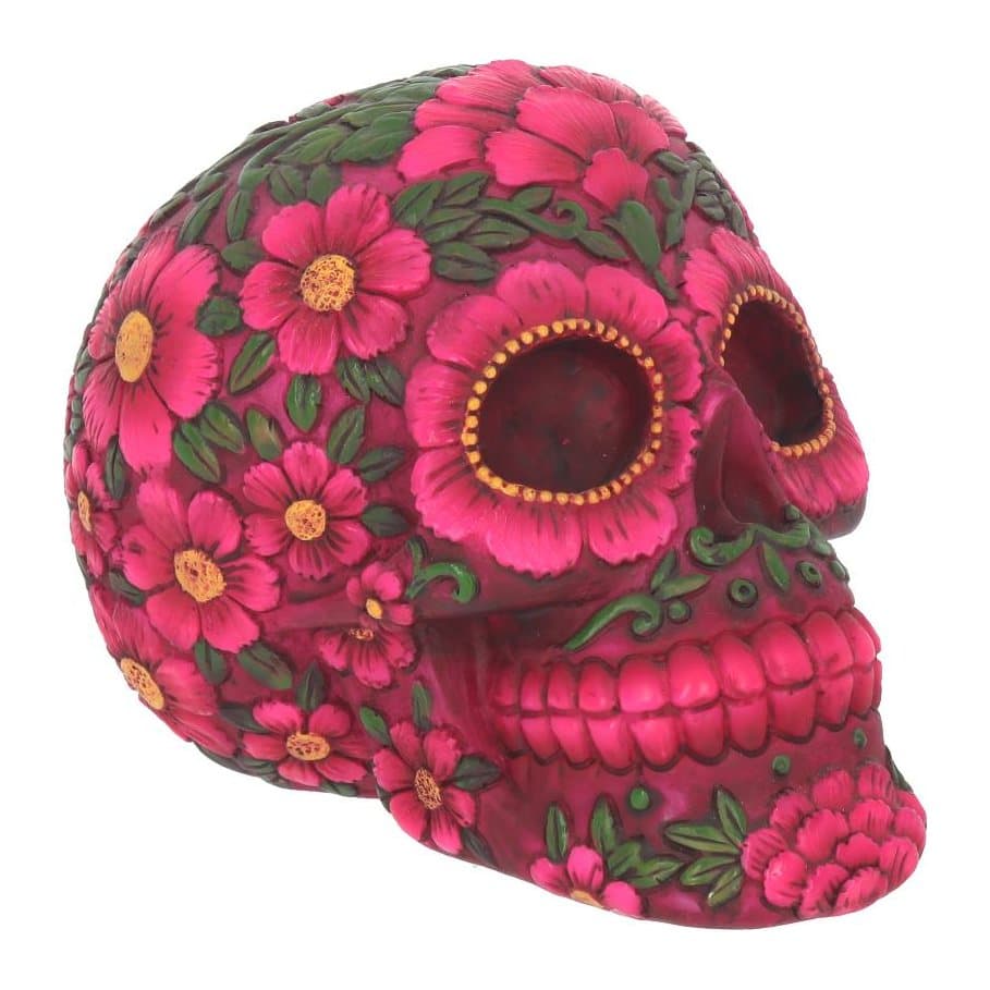 Bright pink skull covered in pink flowers, green leaves and vines